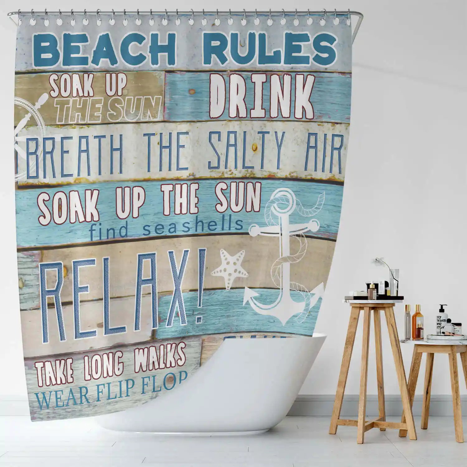 A bathroom with a shower curtain that says beach rules.