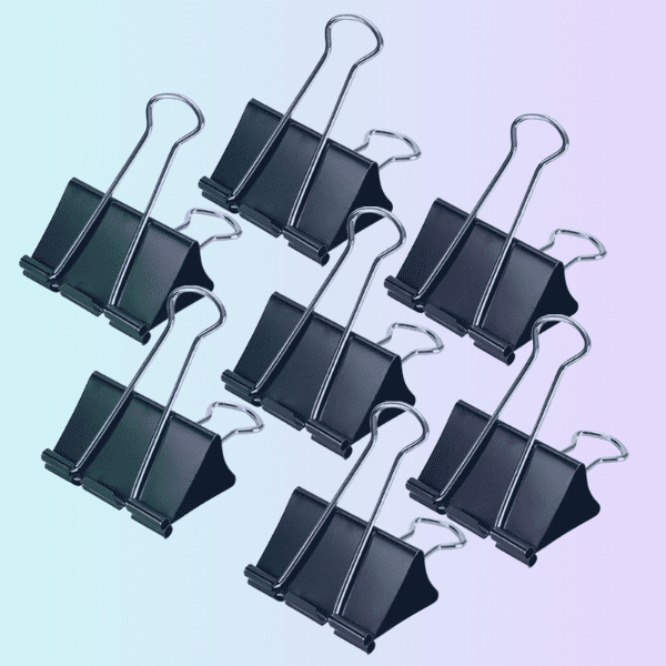 A group of black binder clips used to keep shower curtains from blowing in.