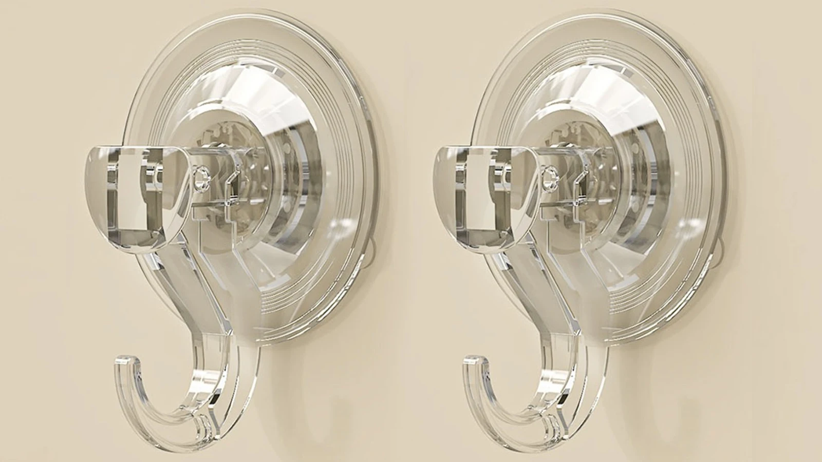 Types of Shower Curtain Hooks: A pair of clear glass hooks on a beige wall.