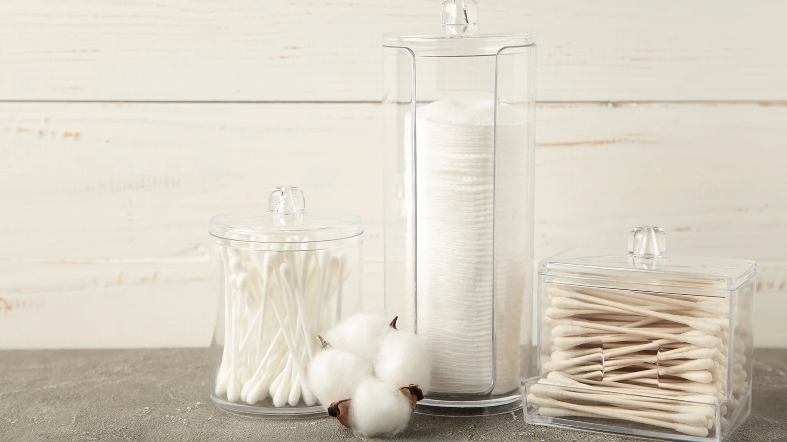 Small bathroom counter decorating ideas: clear jars with cotton swabs and cotton balls.